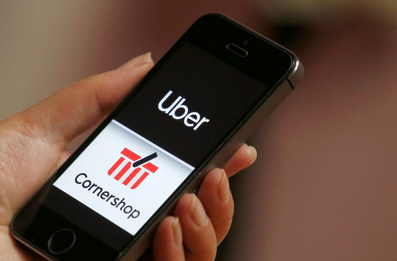 © Reuters. The logo of the Chilean online grocery provider Cornershop next to the logo of Uber application are seen on a mobile phone in this picture illustration taken at Vina del Mar
