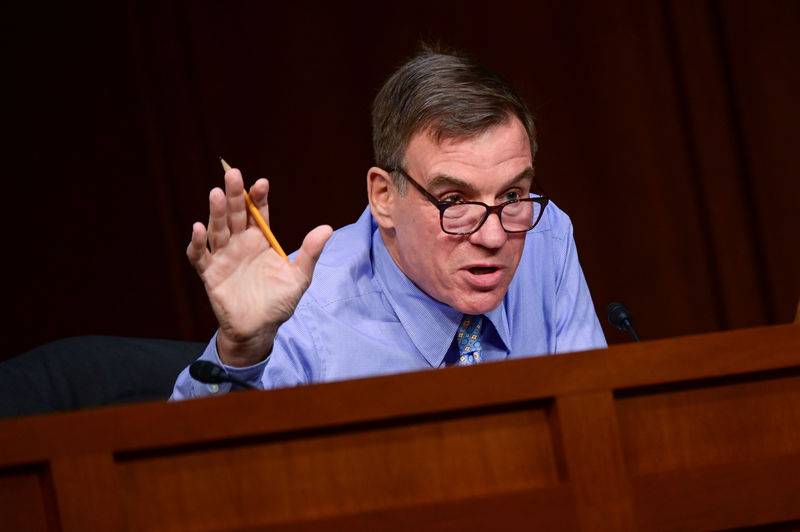 © Reuters. FILE PHOTO: Warner speaks during Facebook digital currency hearing