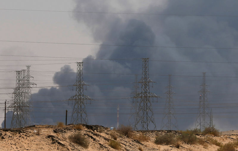 © Reuters. FILE PHOTO: Smoke is seen following a fire at an Aramco factory in Abqaiq