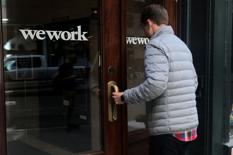 © Reuters. FILE PHOTO: A man walks into a WeWork space in the Manhattan borough of New York City