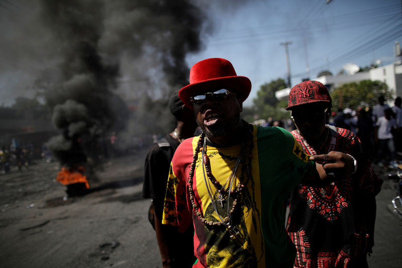 Singing and dancing, Haitians flock to streets in anti-government protest