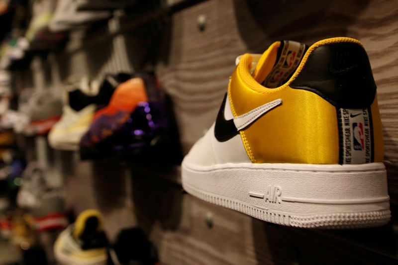 © Reuters. FILE PHOTO: A pair of Nike's Air Force sneakers with a NBA logo is seen display at a Nike store in Beijing