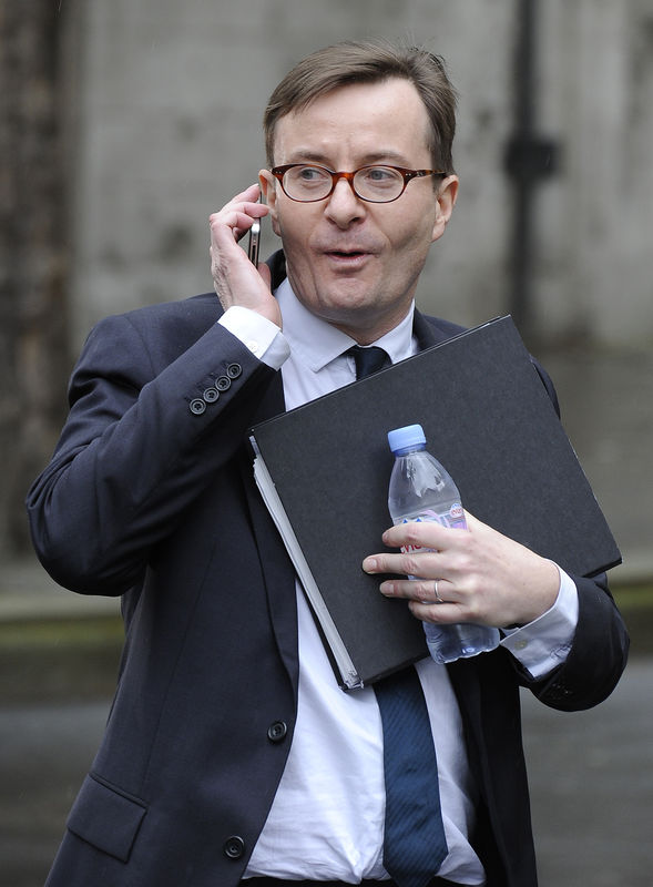 © Reuters. Sky's head of news Ryley leaves the High Court after appearing before the Leveson Inquiry in London