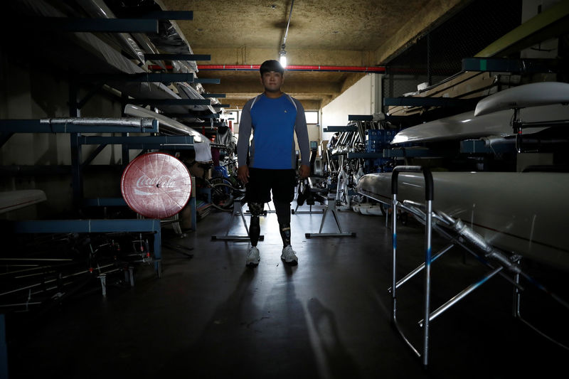 © Reuters. Former South Korean Army sergeant Ha Jae-hun, who lost both his legs in 2015 when he stepped on a North Korean landmine in the DMZ, poses for photographs before a practice session at Misari Rowing Stadium in Hanam, South Korea