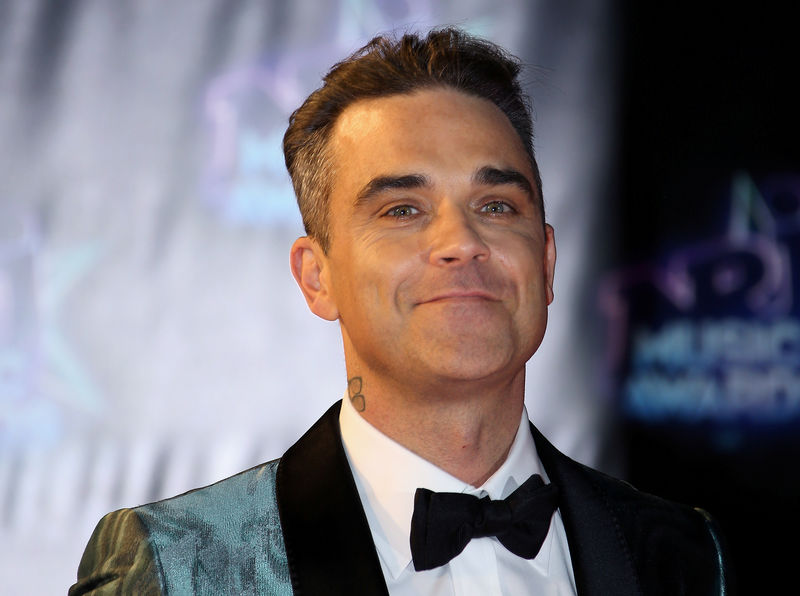 Robbie Williams se inspira en Charles Dickens para su primer álbum navideño