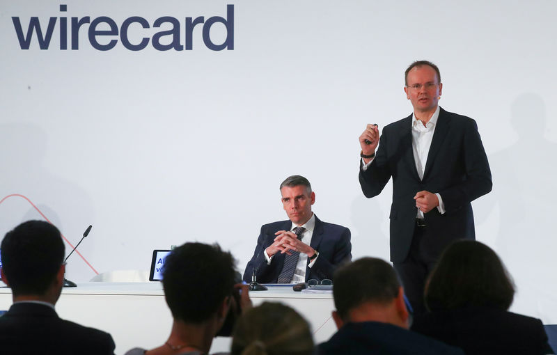 © Reuters. FILE PHOTO: Braun and von Knoop of Wirecard AG attend the company's annual news conference in Aschheim