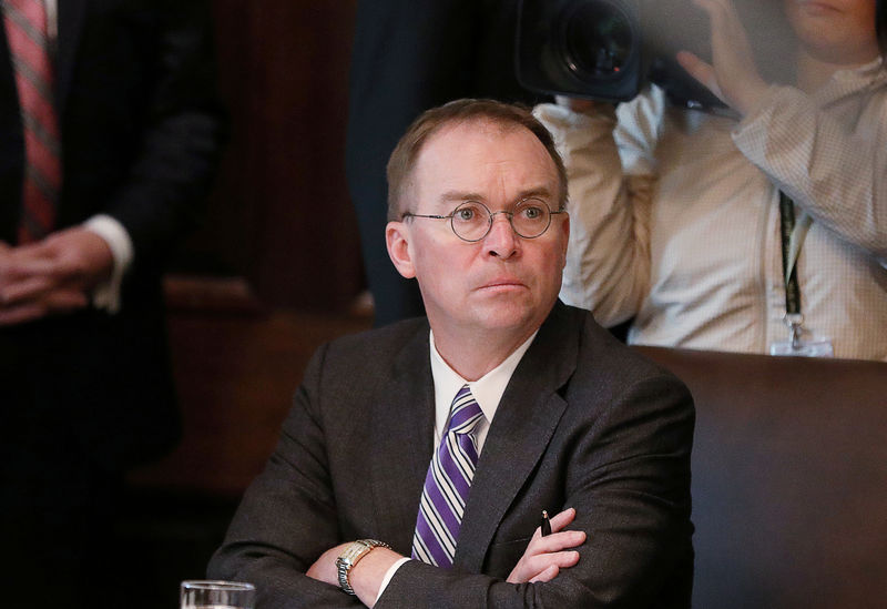 © Reuters. FILE PHOTO: Acting White House Chief of Staff Mulvaney listens during Trump cabinet meeting at the White House in Washington