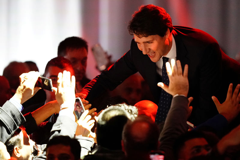 © Reuters. Liberal leader and Canadian Prime Minister Justin Trudeau greets people after the federal election at the Palais des Congres in Montreal