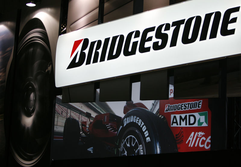 © Reuters. Top Japanese tyre maker Bridgestone Corp's logo is seen at its pavilion at Tokyo Auto Salon 2009 in Chiba