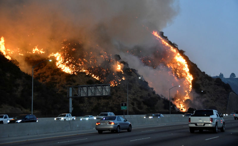 California utility PG&amp;E's stock tumbles as wildfire spreads