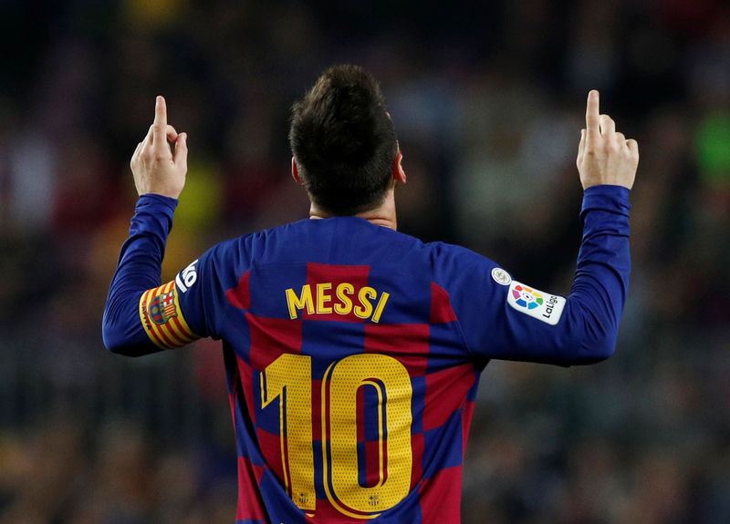 Magical Messi sends Barcelona top in Valladolid rout