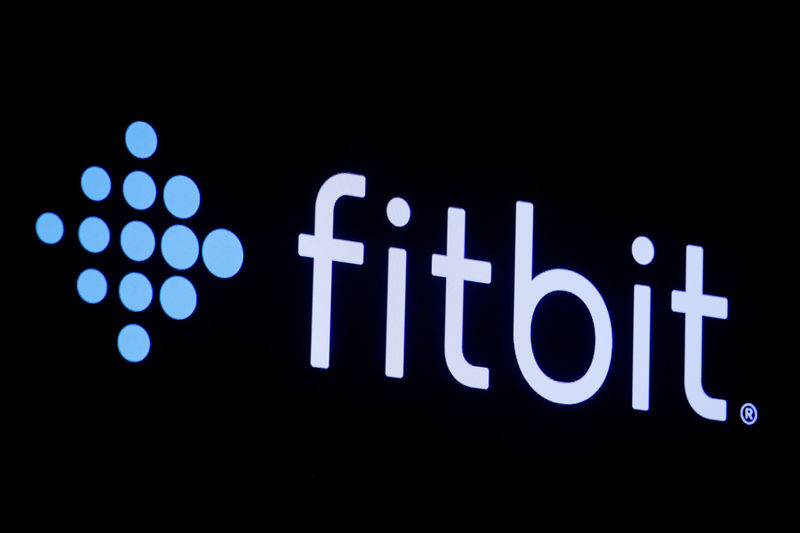 © Reuters. FILE PHOTO: The logo for wearable device maker Fitbit Inc. is displayed on a screen at NYSE floor in New York