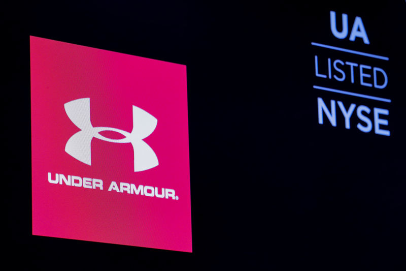 © Reuters. The ticker symbol and company logo for Under Armour, Inc. is displayed on a screen on the floor of the NYSE in New York