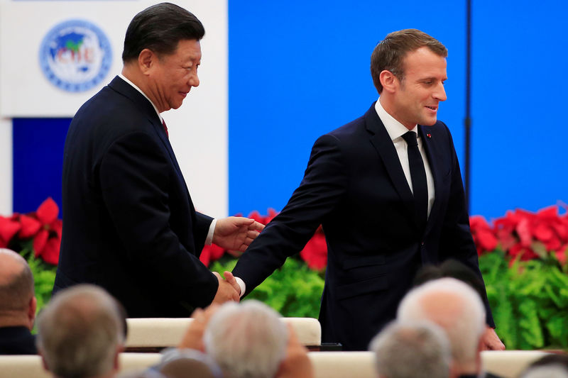 © Reuters. MACRON APPELLE XI À CONSOLIDER L'OUVERTURE DU MARCHÉ CHINOIS