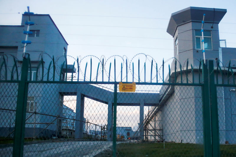 © Reuters. A perimeter fence is constructed around what is officially known as a vocational skills education centre in Dabancheng