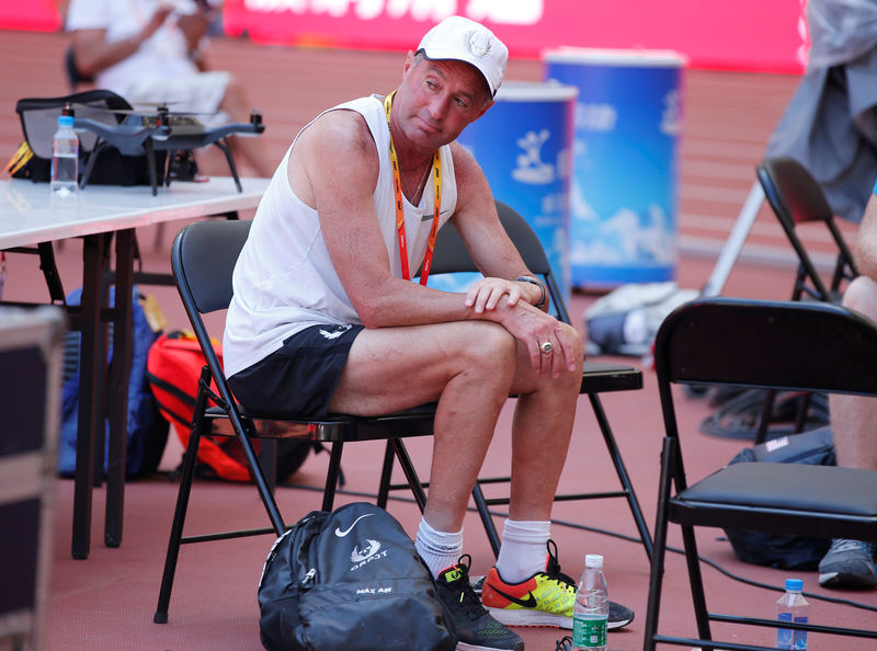 © Reuters. FILE PHOTO: Alberto Salazar, coach to Mo Farah of Britain and Galen Rupp of the U.S.A. sits inside the Bird's Nest Stadium at the Wold Athletics Championships in Beijing
