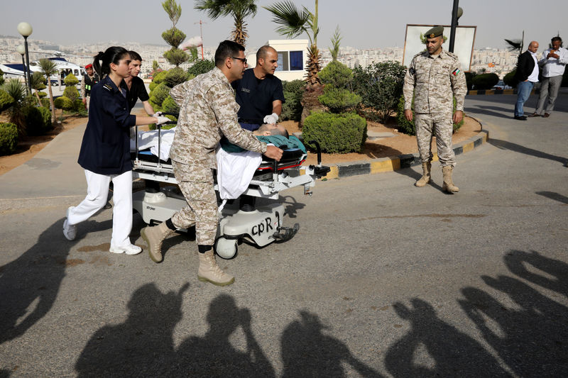 © Reuters. Tourist, who was injured in a stabbing, is rushed into King Hussein Medical Center in Amman