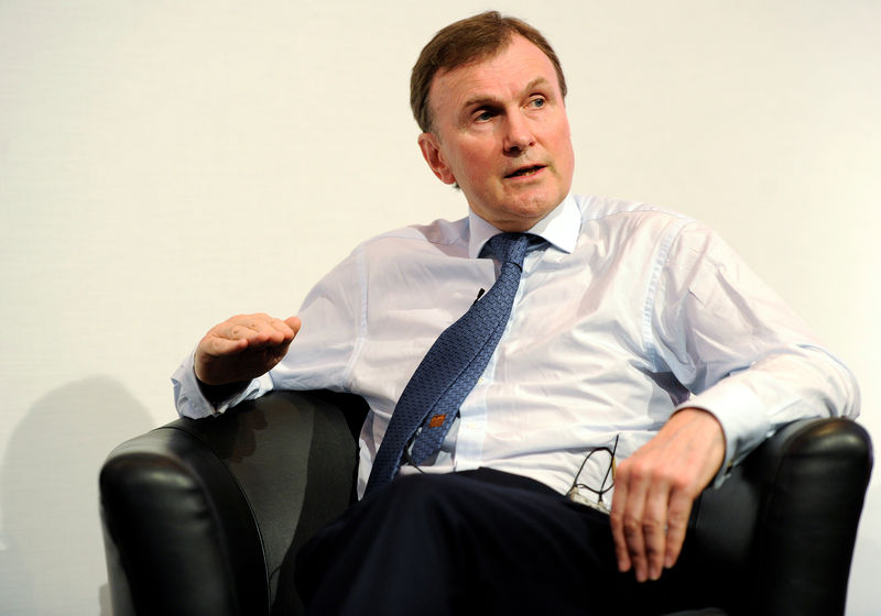 © Reuters. FILE PHOTO: Archie Norman, the chairman of broadcaster ITV, speaks at the Retail Week conference in London