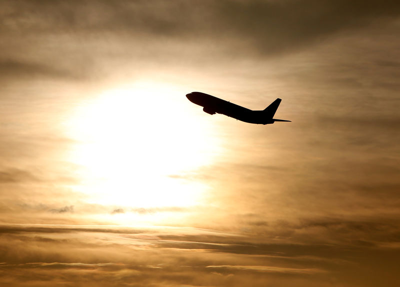 © Reuters. FILE PHOTO: A plane is seen during sunrise at the international airport in Munich