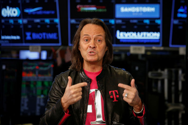 © Reuters. T-Mobile CEO John Legere speaks about his company's merger with Sprint during an interview on CNBC on the floor of the NYSE in New York City