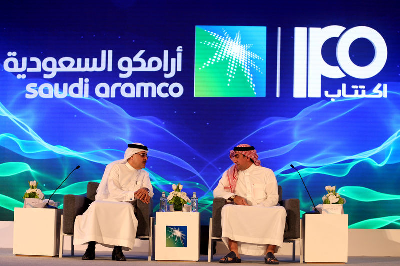 © Reuters. FILE PHOTO: Amin H. Nasser, president and CEO of Aramco, and Yasser al-Rumayyan, Saudi Aramco's chairman, attend a news conference in Dhahran