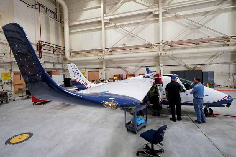 © Reuters. Technicians work on NASA's first all-electric plane, the X-57 Maxwell,  at NASA's Armstrong Flight Research Center at Edwards Air Force Base, California