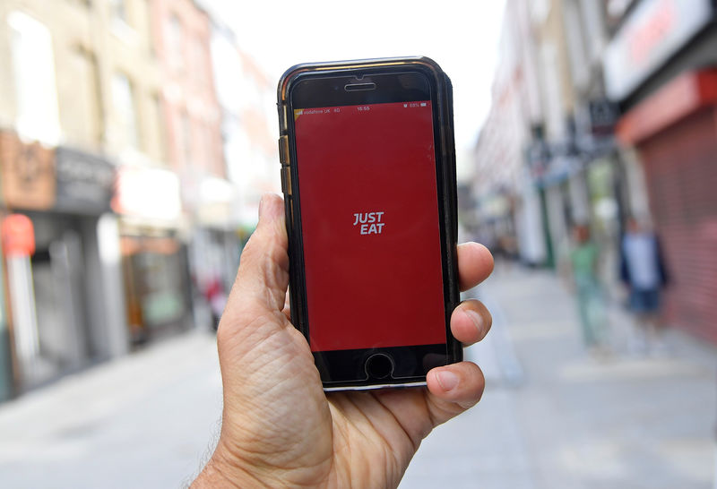 © Reuters. The app for Just Eat is displayed on a smartphone, in London