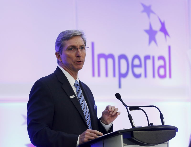 © Reuters. President and CEO Kruger of Imperial Oil addresses shareholders during the company's annual general meeting in Calgary.