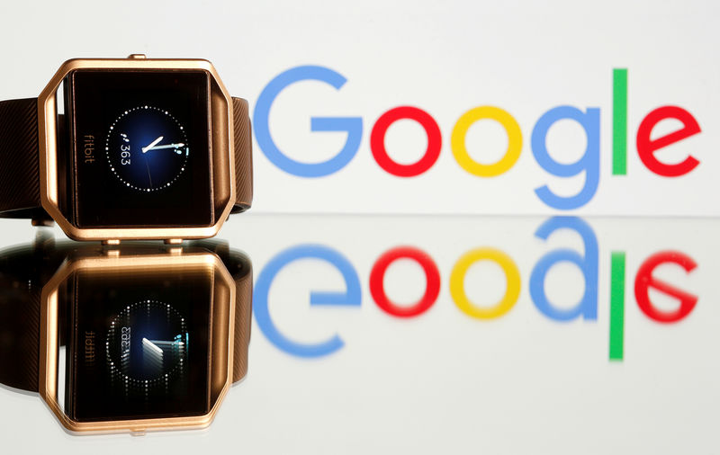© Reuters. Fitbit Blaze watch is seen in front of a displayed Google logo in this illustration