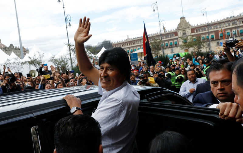 © Reuters. Bolivia's ousted president Evo Morales leaves after a ceremony where he was recognized as a distinguished guest, outside the town hall in Mexico City