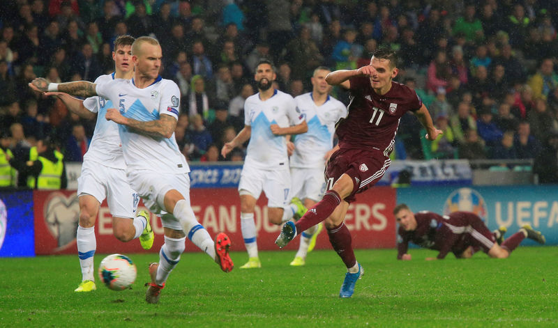 Own goal keeps Slovenia's faint hopes alive