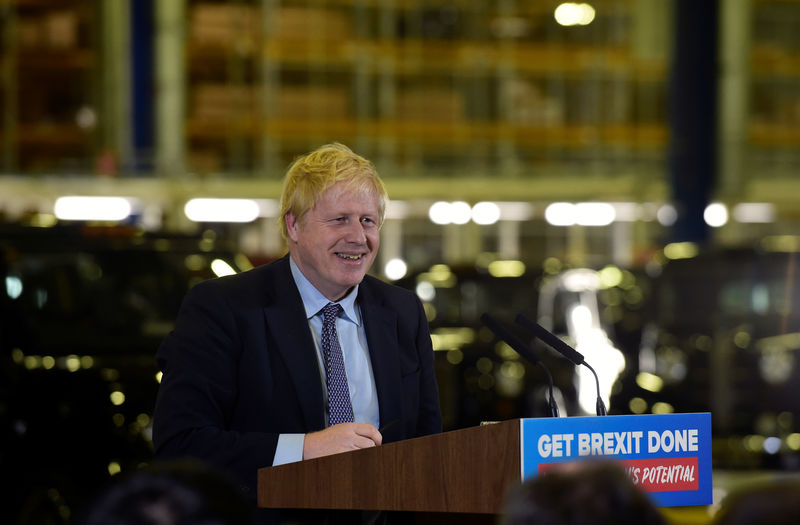 © Reuters. Britain's PM Johnson visits an electric car plant in Warwickshire