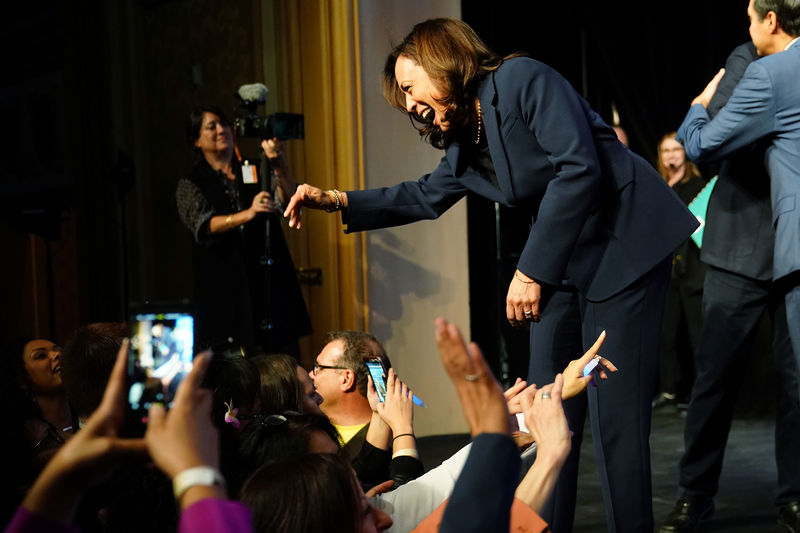© Reuters. Kamala Harris waves to supporters on stage at a First in the West Event at the Bellagio Hotel in Las Vegas