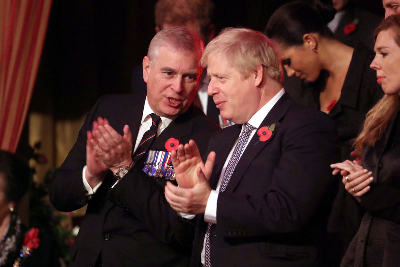 © Reuters. Britain's Prince Andrew and Prime Minister, Boris Johnson, attend the Festival of Remembrance in London