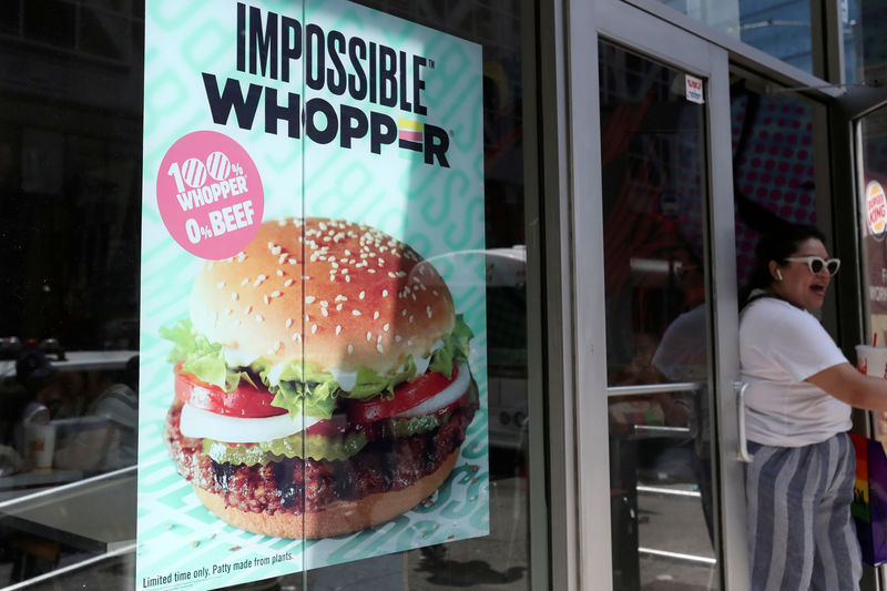 © Reuters. FILE PHOTO: A sign advertising the soy based Impossible Whopper is seen outside a Burger King in New York