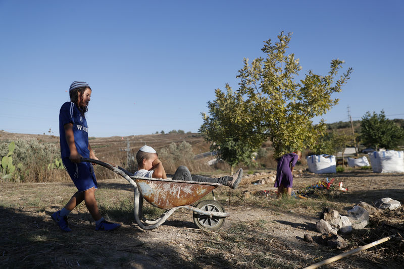 Israel's settlers and the Palestinians they live among