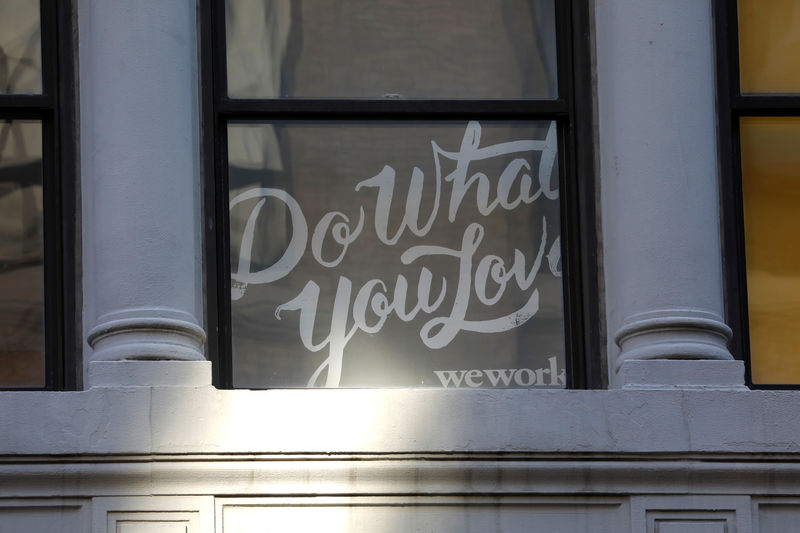 © Reuters. A sign is seen in a window at the WeWork corporate headquarters in Manhattan, New York