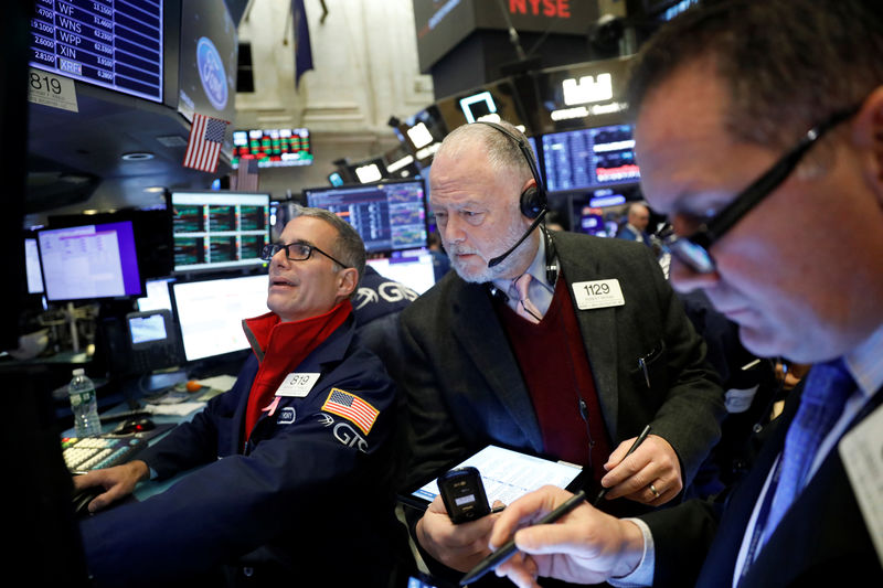 © Reuters. Traders work on the floor of the New York Stock Exchange shortly after the opening bell in New York City