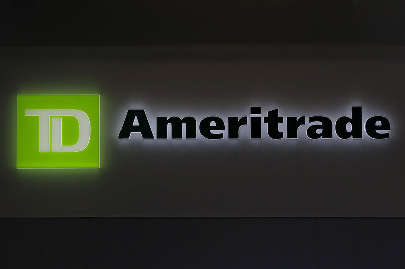 © Reuters. FILE PHOTO: A TD Ameritrade sign glows at the entrance to a branch in the financial district in New York
