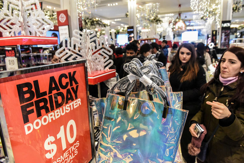 © Reuters. FILE PHOTO: People shop during a Black Friday sales event at Macy's flagship store in New York City