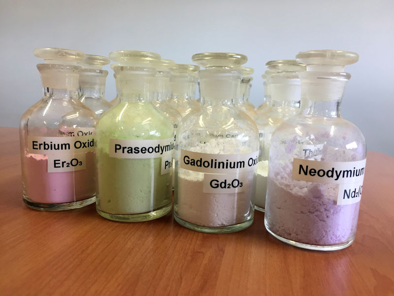 © Reuters. FILE PHOTO: Jars containing rare earth minerals produced by Australia's Lynas Corp from its Mount Weld operations are seen near Laverton, Australia