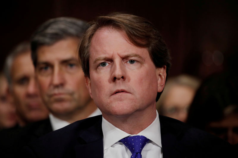 © Reuters. FILE PHOTO: White House coounsel Don Mcgahn listens to U.S. Supreme Court nominee Kavanaugh testify at his Senate Judiciary Committee confirmation hearing on Capitol Hill in Washington