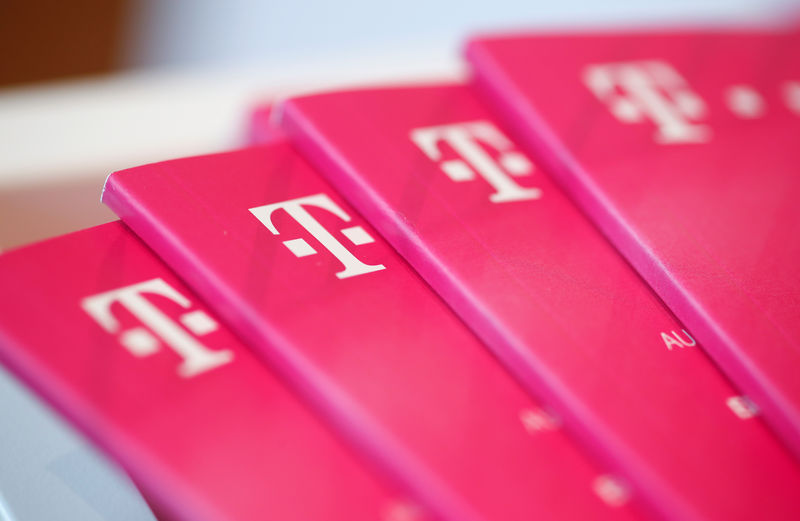 © Reuters. Brochures with the logo of Deutsche Telekom AG are pictured at the shop in the headquarters of German telecommunications giant in Bonn