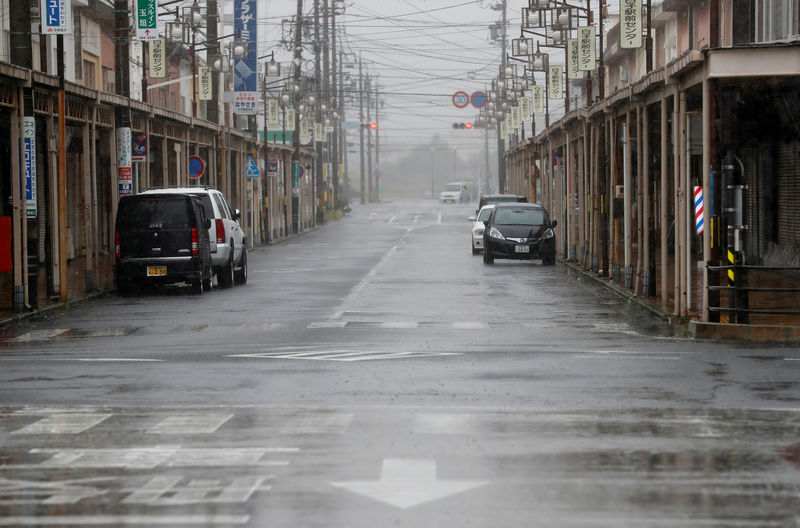 © Reuters. An empty road leading into Shiroko, Suzuka, Japan October 12, 2019, seen in heavy rain ahead of Typhoon Hagibis