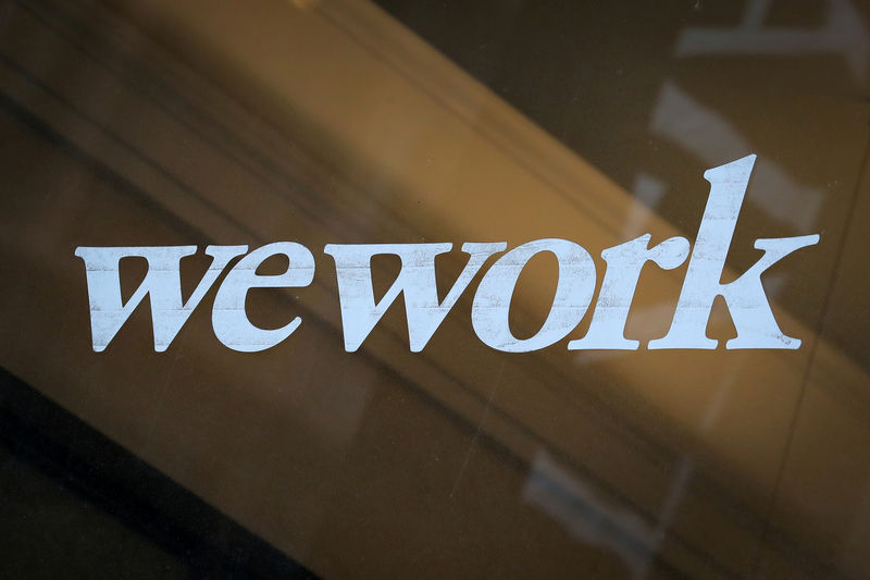 © Reuters. FILE PHOTO: The WeWork logo is displayed on the entrance of a co-working space in New York