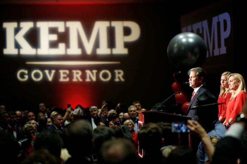 © Reuters. FILE PHOTO: Following mid-term elections, Republican gubernatorial candidate Brian Kemp reacts after appearing at his election night party in Athens