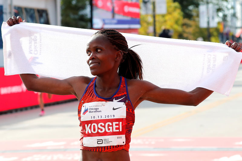 © Reuters. Chicago Marathon - Kenya's Brigid Kosgei reacts after winning the women's marathon setting a new world record