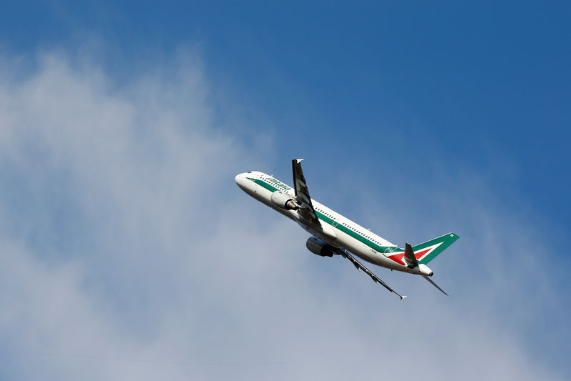 © Reuters. An Alitalia plane carrying Pope Francis for one-day visit to Geneva takes off at the Leonardo da Vinci-Fiumicino Airport in Rome