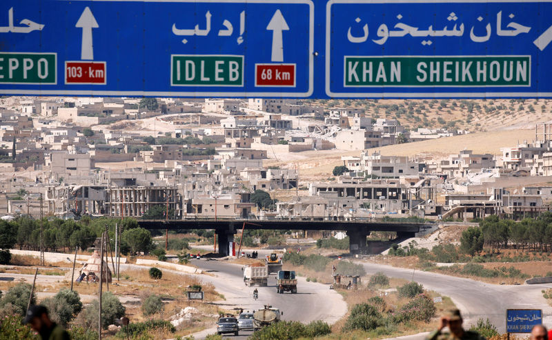 © Reuters. FILE PHOTO: Road direction signs are pictured at the entrance en route to Khan Sheikhoun, Idlib