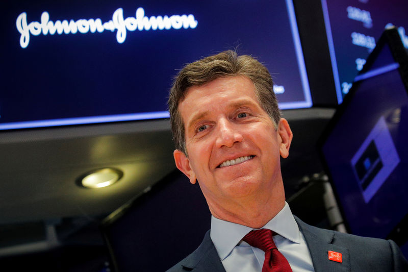 © Reuters. FILE PHOTO: Alex Gorsky, Chairman and CEO of Johnson & Johnson, celebrates the 75th anniversary of his company's listing on the floor at the NYSE in New York